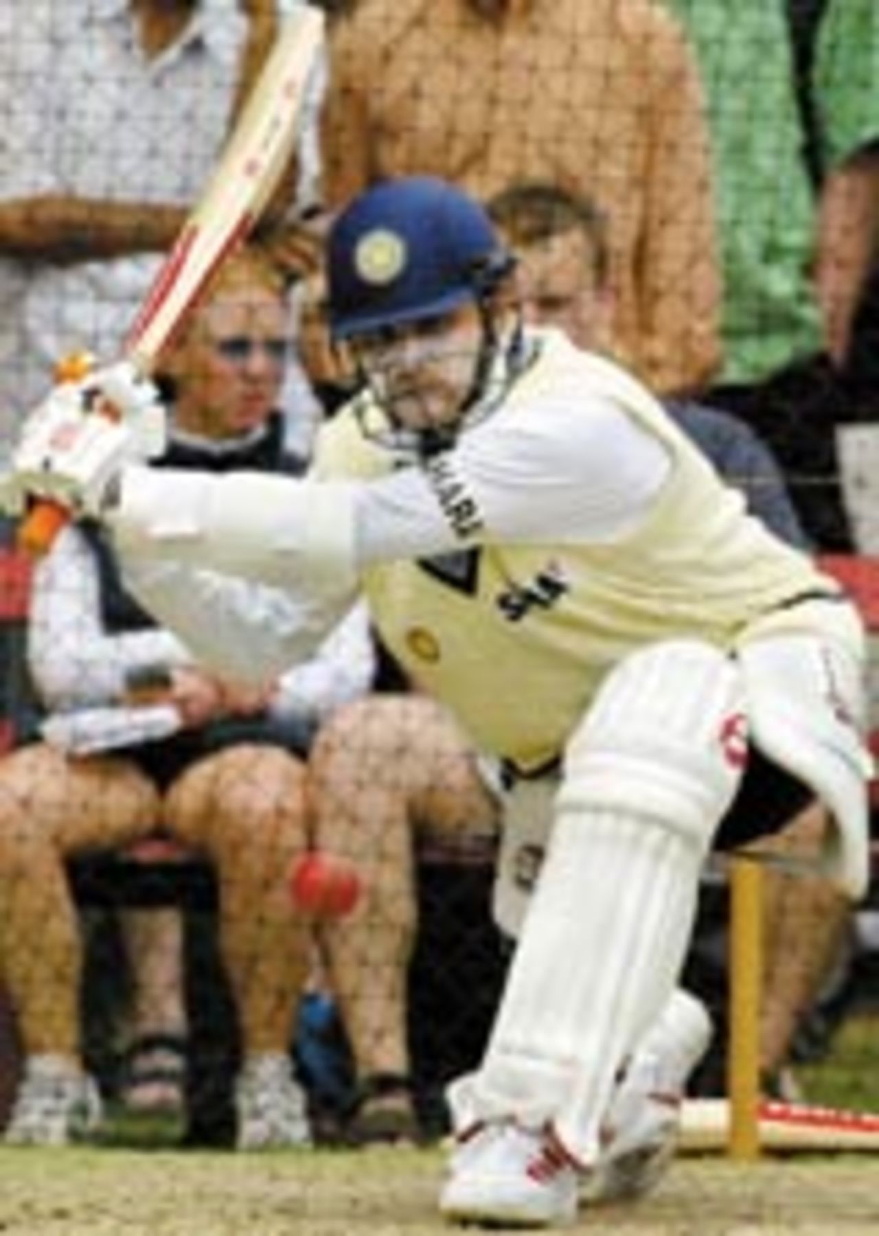 Indian opening batsman Virender Sehwag prepares to sweep during a net session as India prepares for the second cricket Test against Australia, in Adelaide 11 December 2003. Australia and India drew the first Test Match and play starts tomorrow 12 December