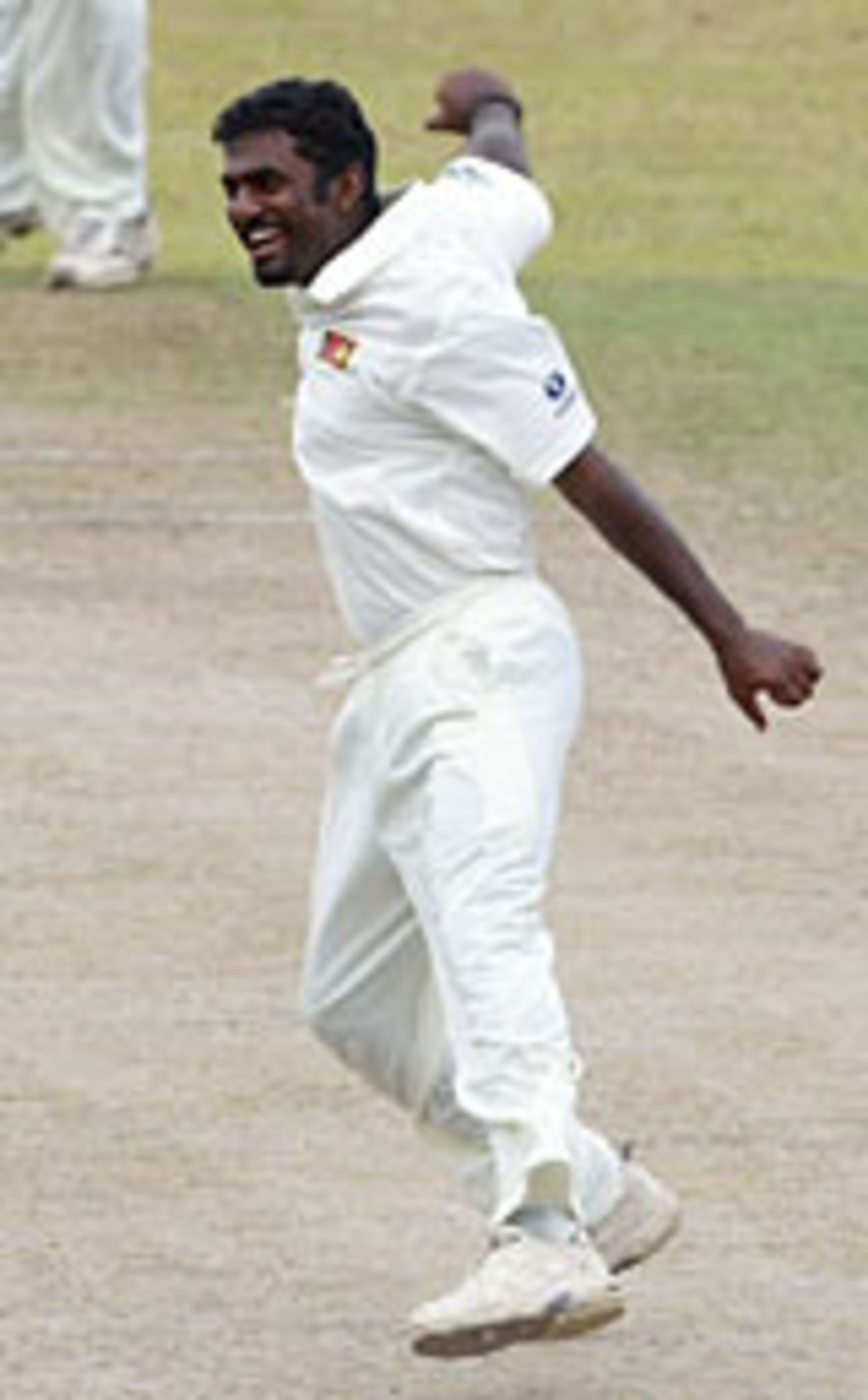 Muttiah Muralitharan celebrates the key wicket of Graham Thorpe, Sri Lanka v England, 2nd Test, Kandy, December 12, 2003