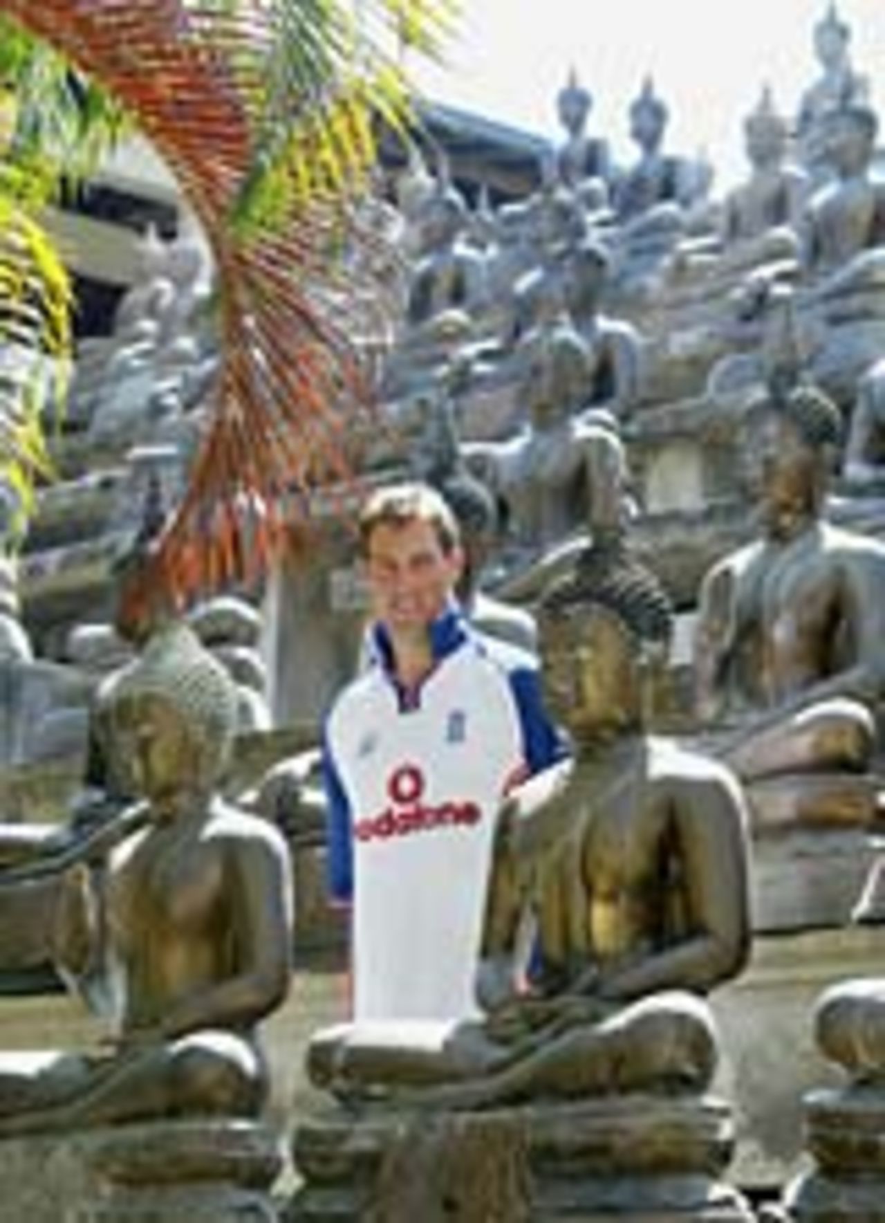 Marcus Trescothick poses among Buddha statues, December 1, 2003