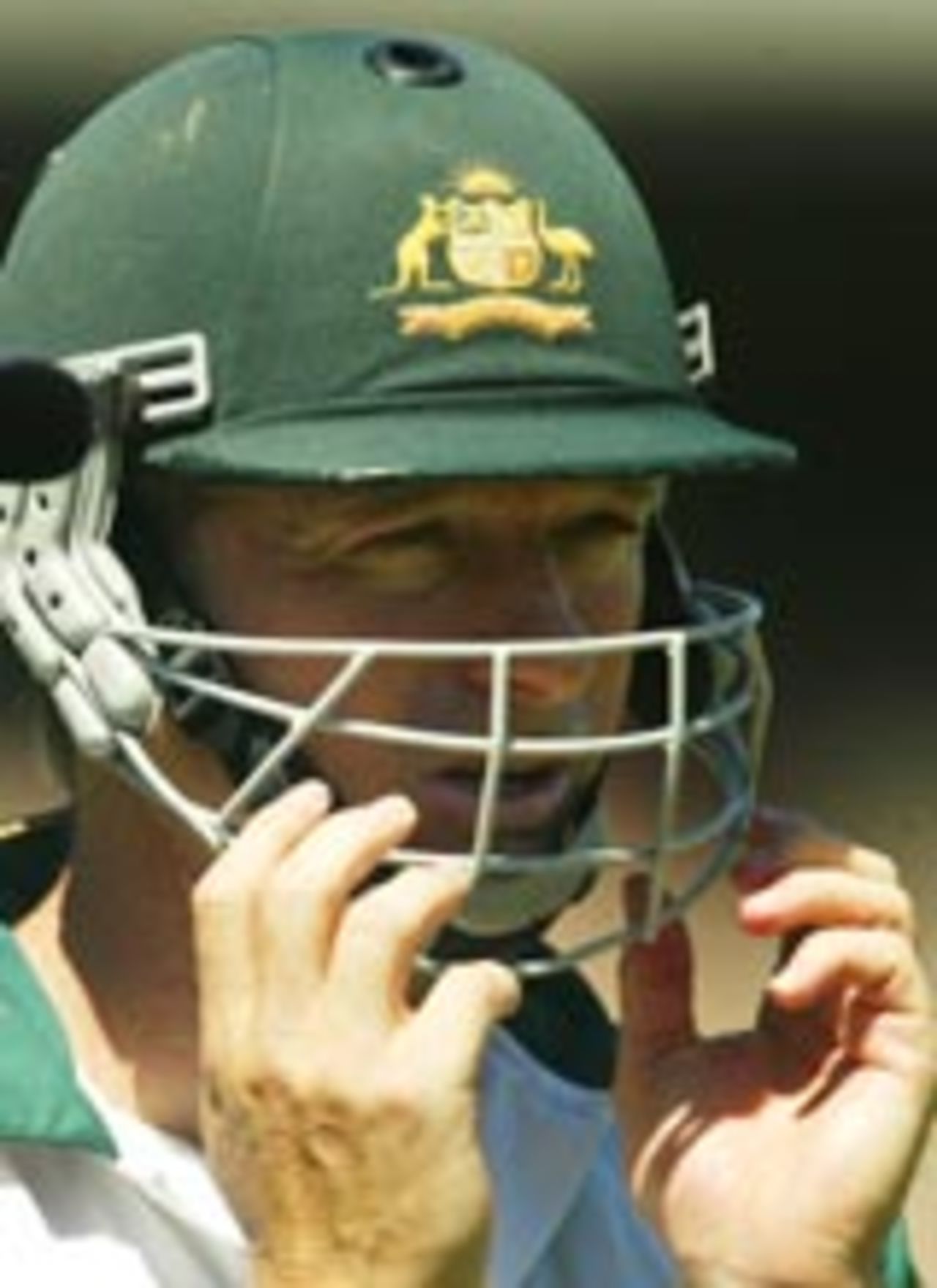 Steve Waugh puts on his helmet in the nets before the Test against India, Melbourne, December 24, 2003