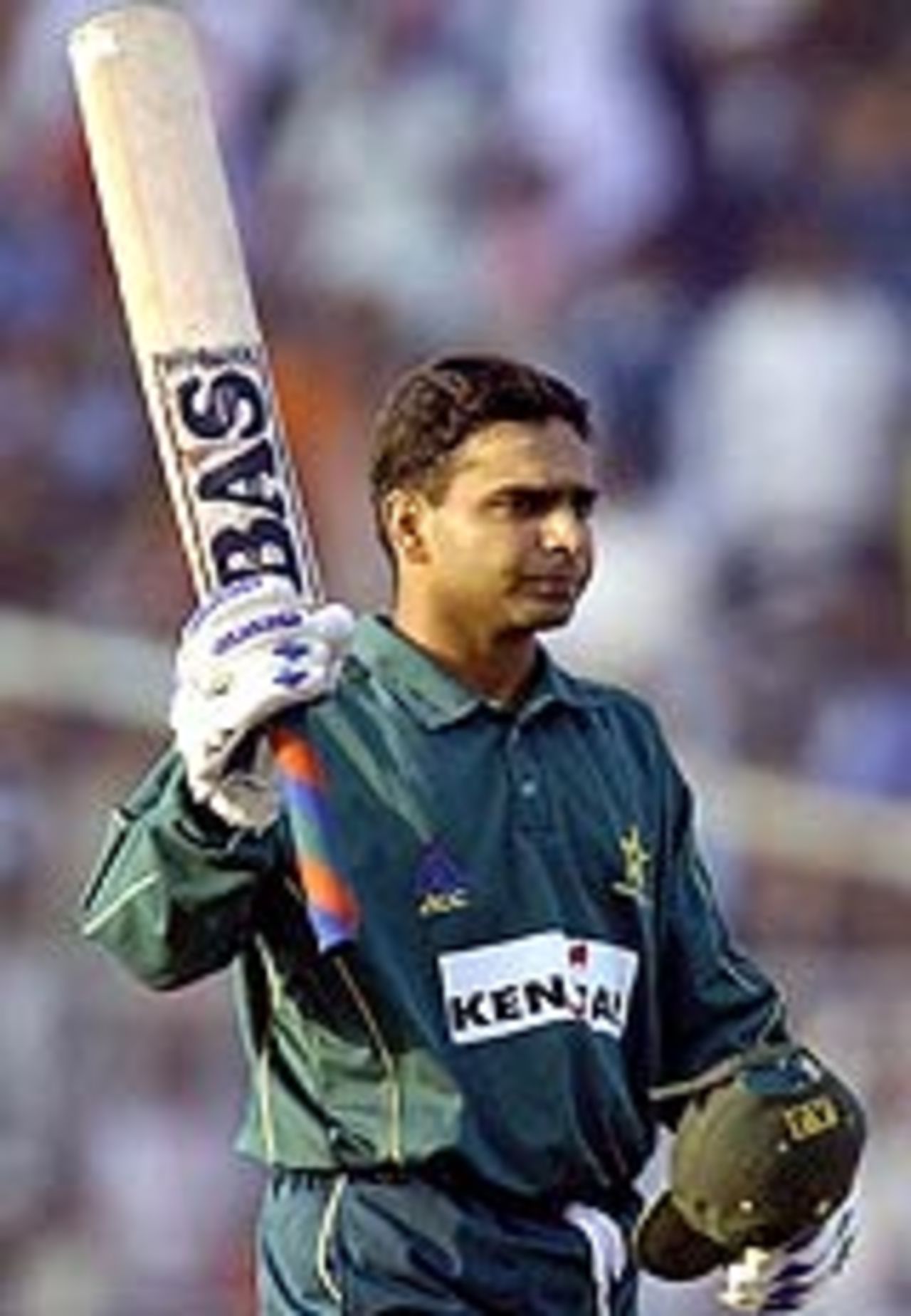 Naved Latif acknowledges the applause after reaching his century, India A v Pakistan A, Kenstar Tournament, Kolkata, December 25, 2003
