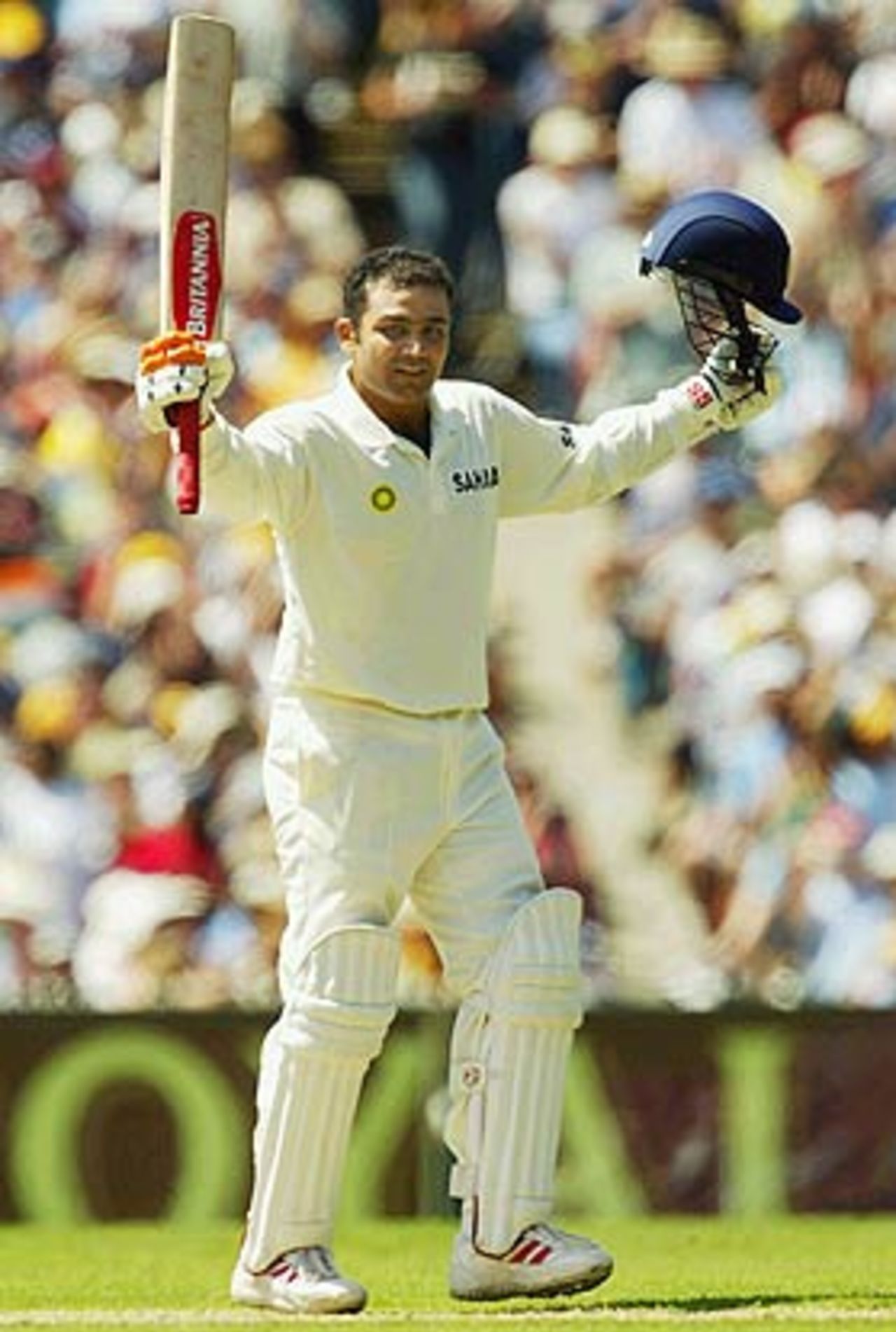Technique, you say? Here, watch my elbow as I raise my bat. Virender Sehwag celebrates his century, Australia v India, 3rd Test, Melbourne, 1st day, December 26, 2003