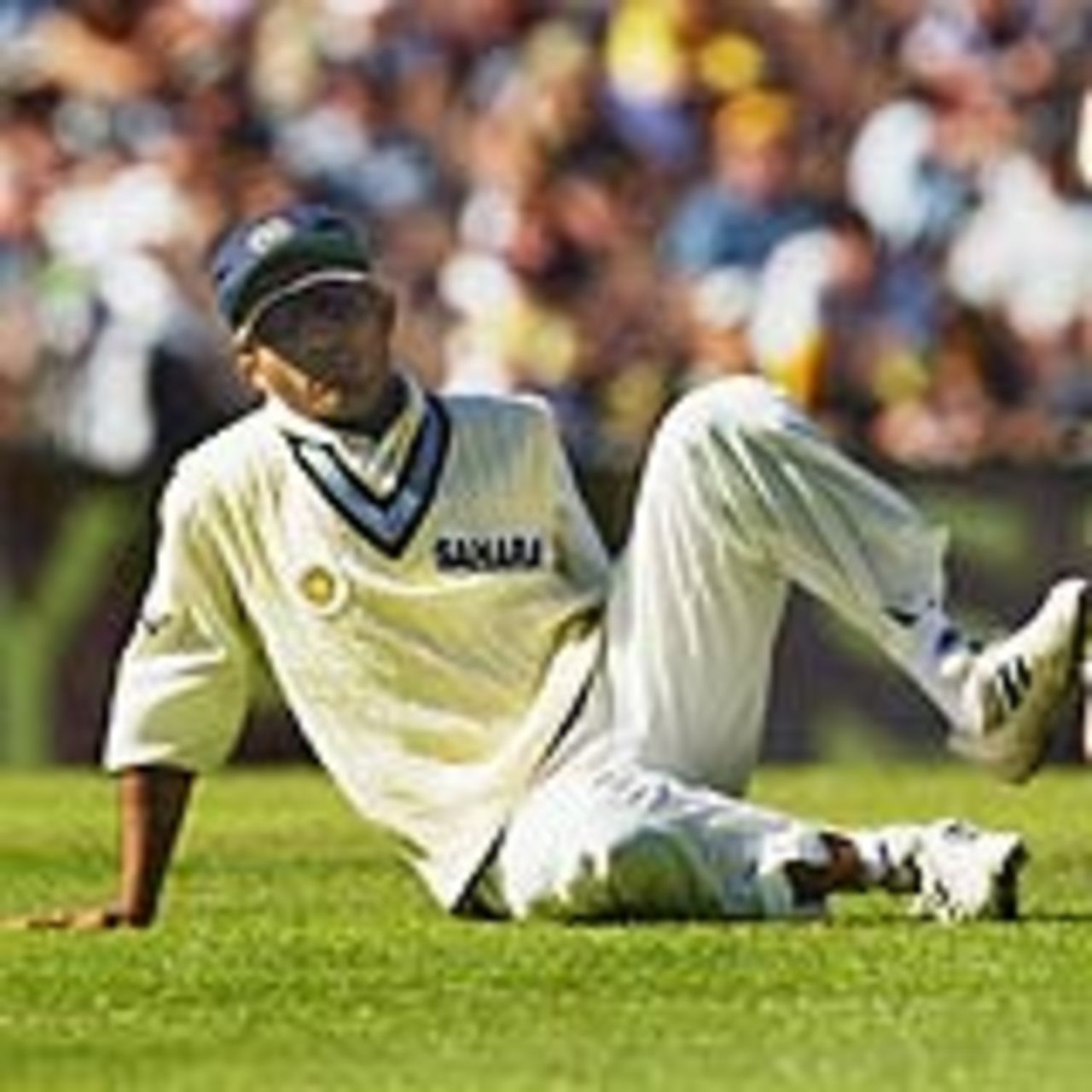 Sourav Ganguly sits despondently on the ground after a misfield, Australia v India, 3rd Test, Melbourne, 2nd day, December 27, 2003
