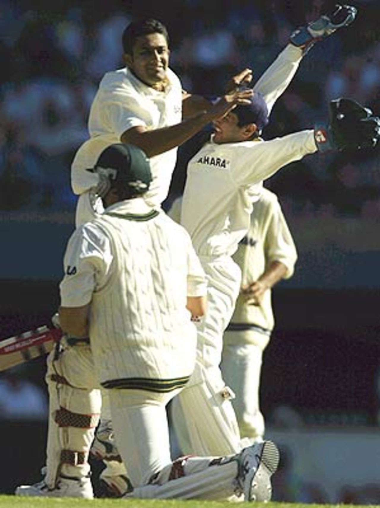 On your knees. Get set. Go. Anil Kumble and Parthiv Patel celebrate as Matthew Hayden is finally out, 3rd Test, Melbourne, 2nd day, December 27, 2003