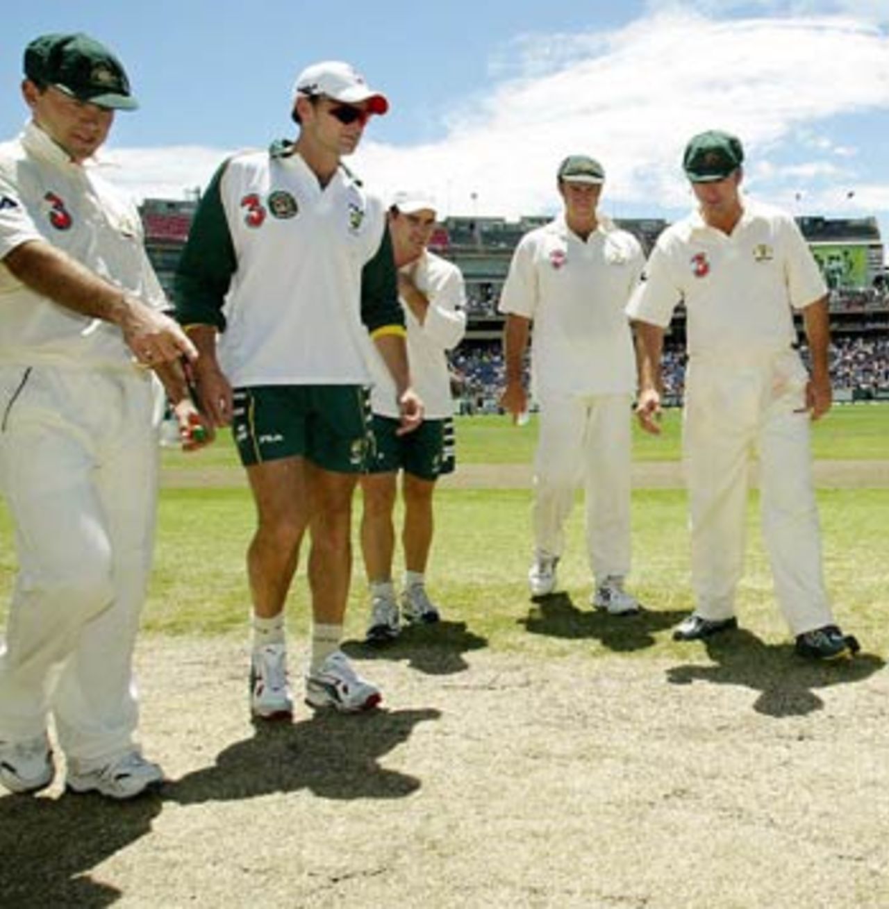 Ricky Ponting points to the repaired spot on the pitch that was the talking point after the game, Australia v India, 3rd Test, Melbourne, 5th day, December 30, 2003