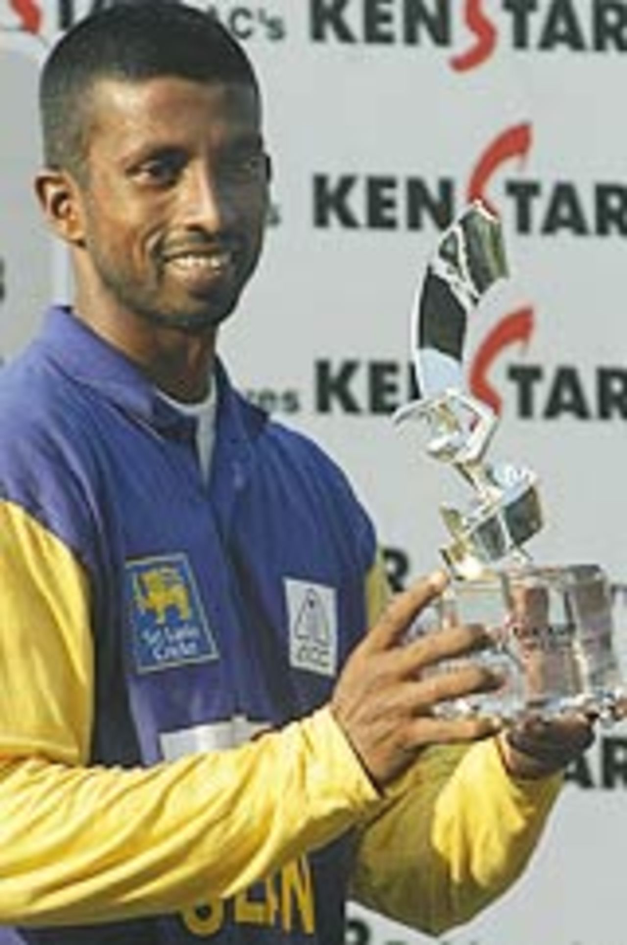Russel Arnold holds aloft the Kenstar trophy after his team beat India A in the final, India A v Sri Lanka A, Final, Kenstar tri-series, Kolkata, 30th December, 2003