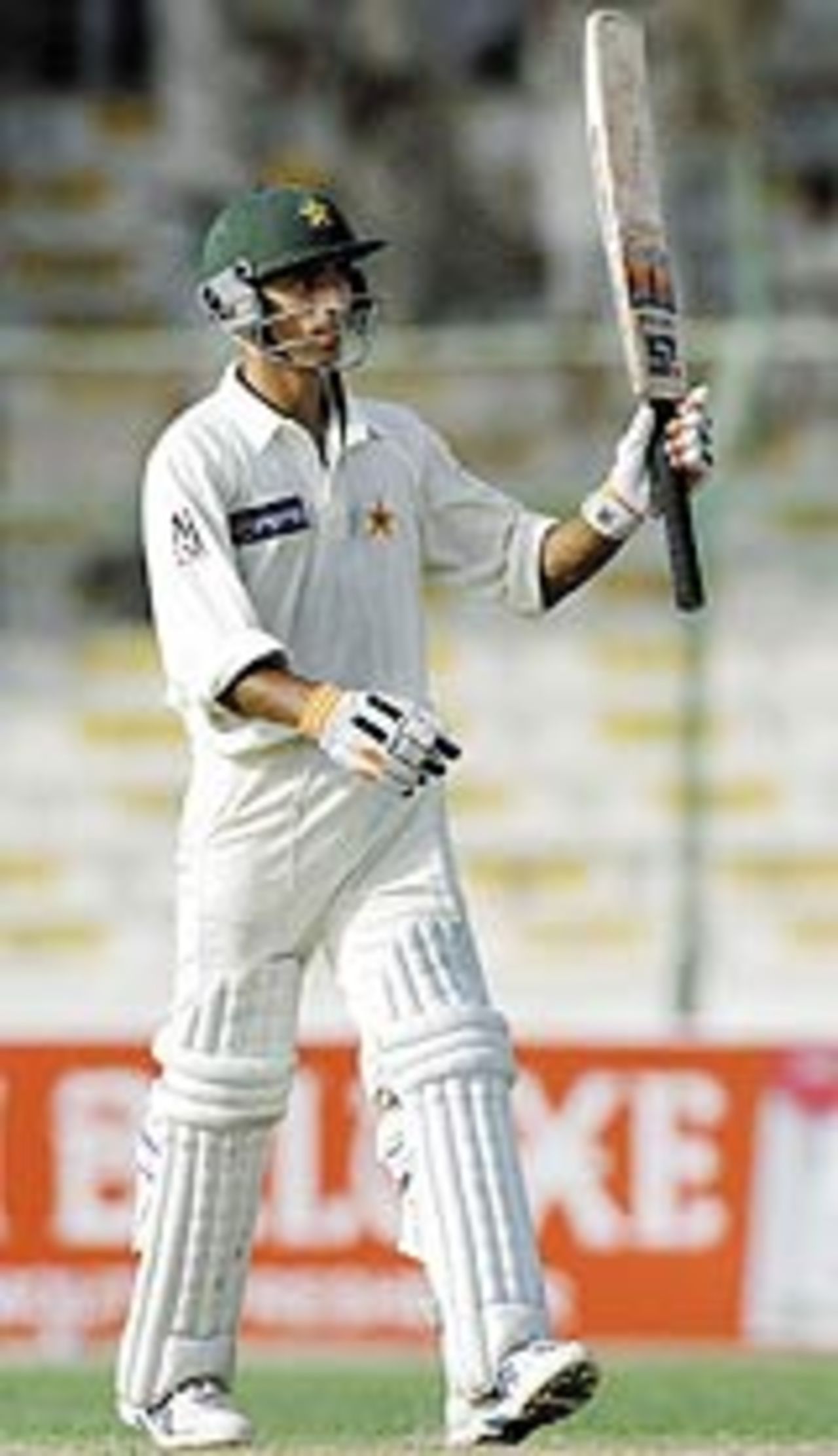 Yasir Hameed raises his bat after compeleting a half century, Pakistan v Bangladesh, 1st Test, Karachi, 4th day, 23 August, 2003