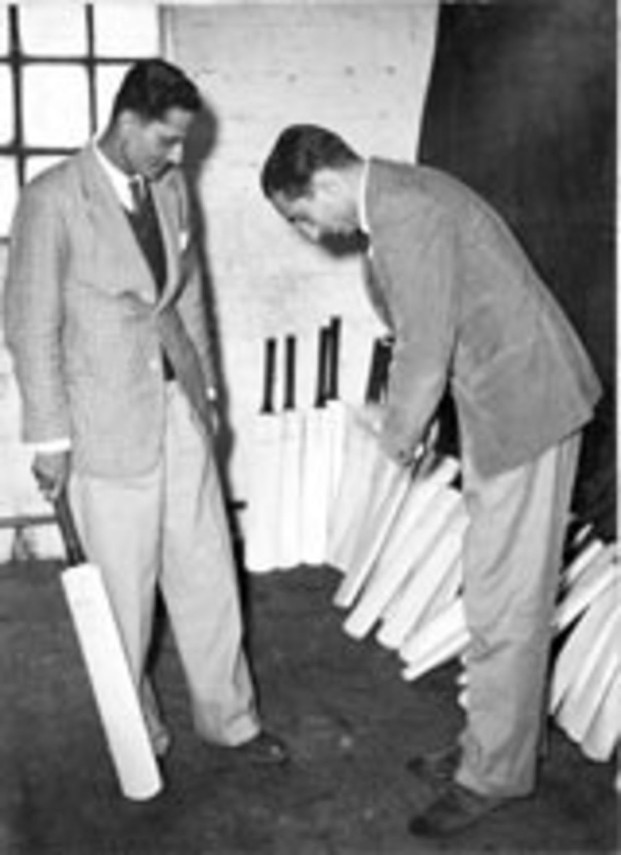 Vijay Hazare and Nawab of Pataudi Sr check out some bats during the tour to England in 1946