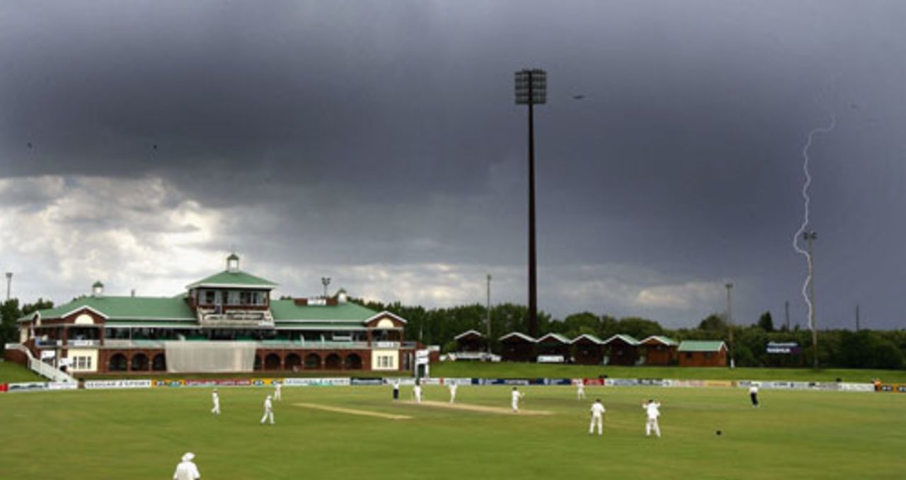 Lightning strikes are dark clouds loom over Sedgars Park in Potchefstroom, South Africa A v England XI, third day, December 13 2004