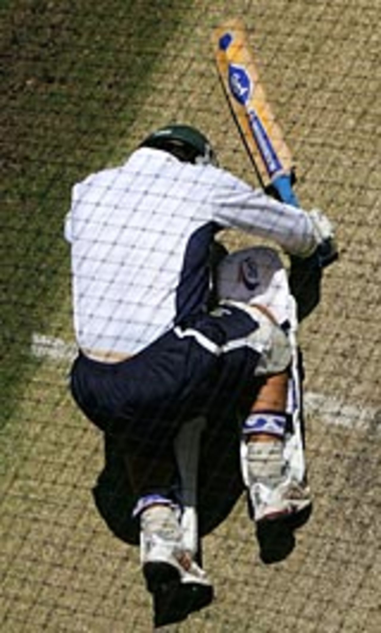Justin Langer feels the pain after being felled by a bouncer in the nets at Perth, December 14, 2004