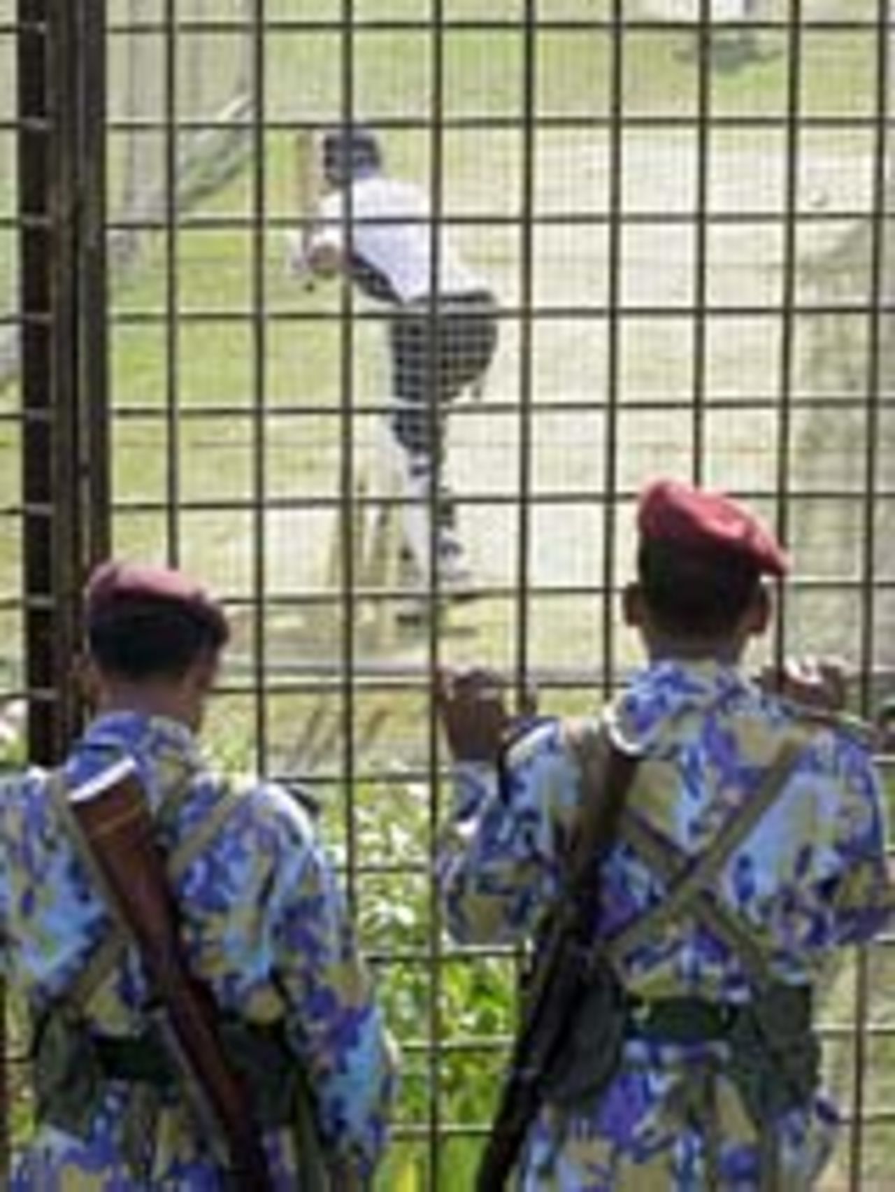 Armed guards oversee a net session on the eve of the second Test, Chittagong, December 16, 2004
