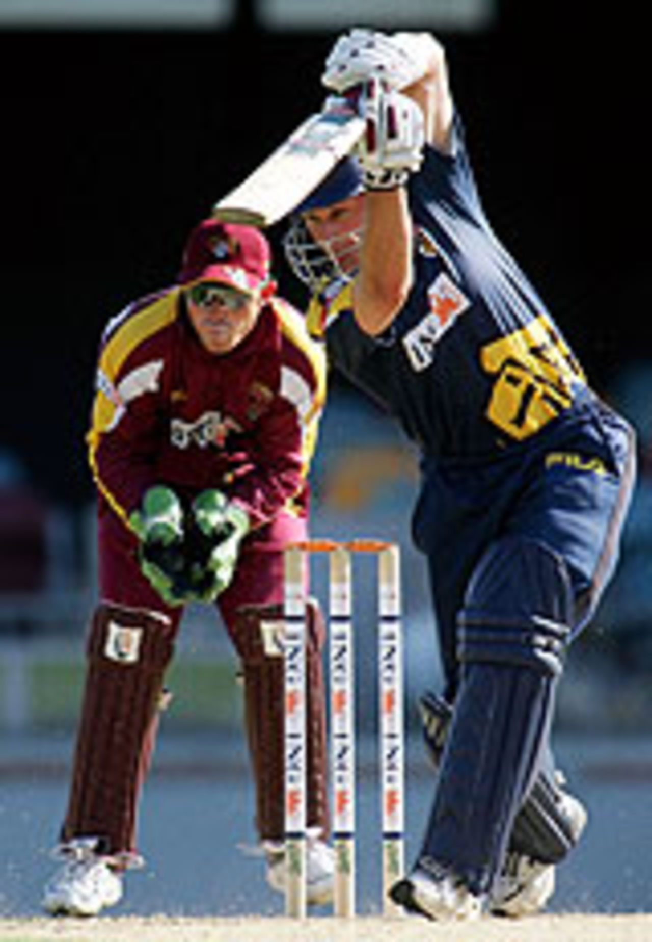 David Hussey launches into a drive, Queensland v Victoria, ING Cup, December 17, 2004