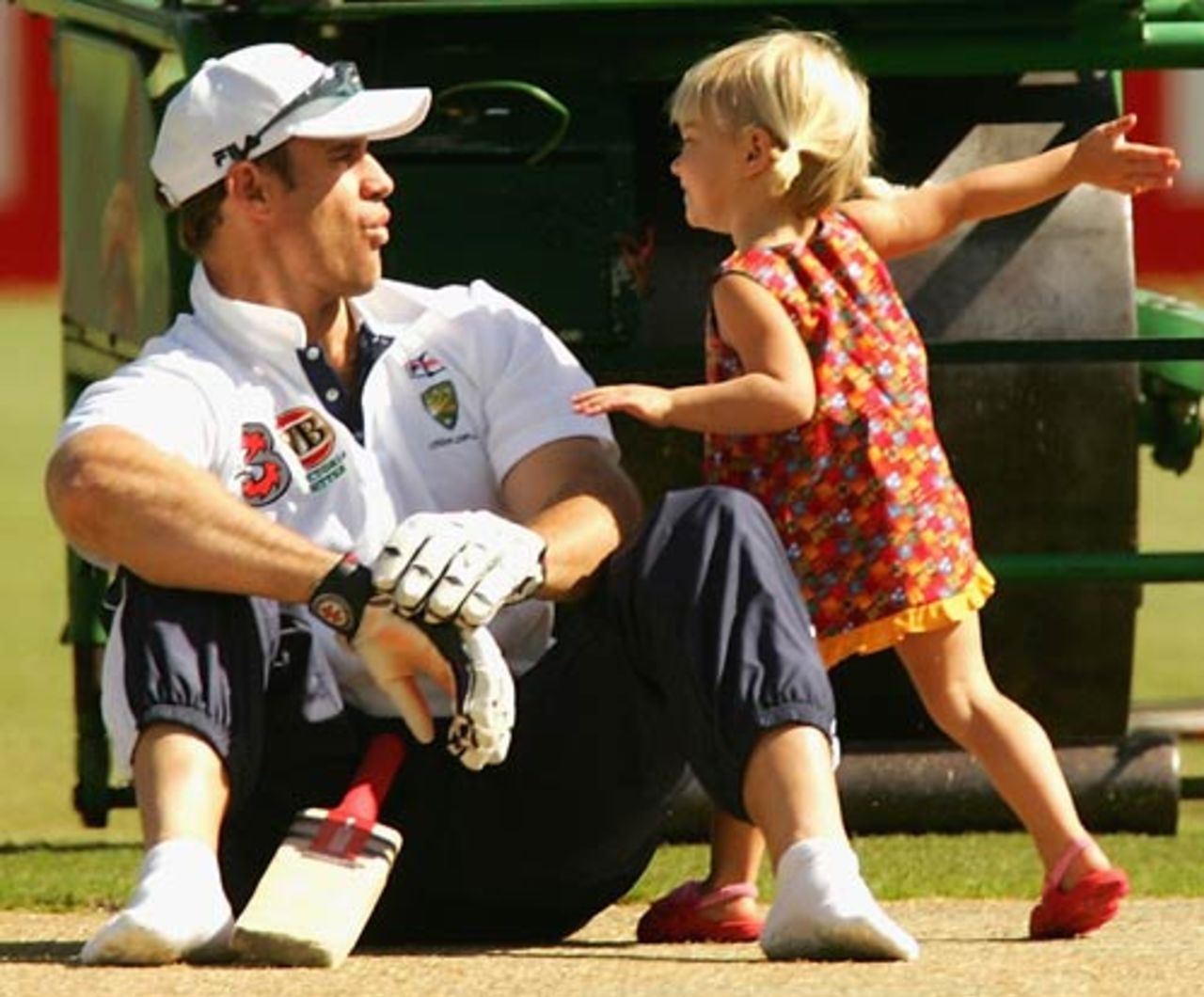 Matthew Hayden playing around with his daughter Grace, Melbourne, December 25, 2004