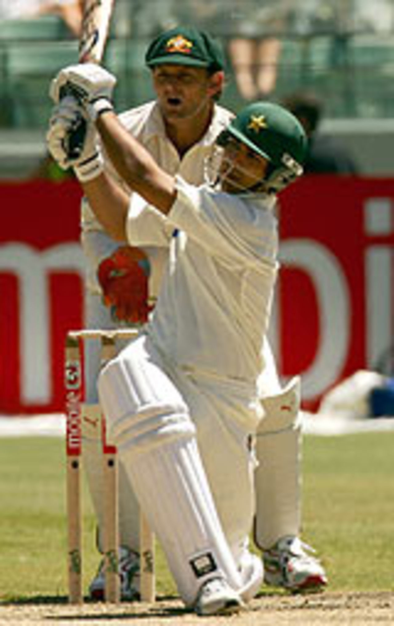 Salman Butt hits out as Adam Gilchrist looks on, Australia v Pakistan, 2nd Test, Melbourne, December 26, 2004