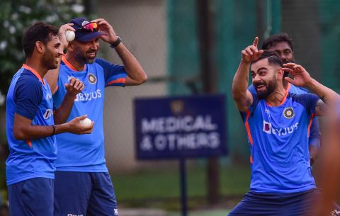 Virat Kohli and Bhuvneshwar Kumar share a light moment as Paras Mhambrey watches on, India vs Australia, Mohali, September 19, 2022