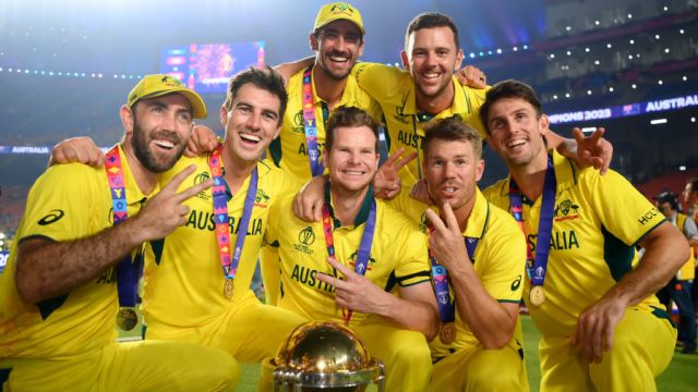 Two-time ODI World Cup winners - Glenn Maxwell, Pat Cummins, Mitchell Starc, Steven Smith, Josh Hazlewood, David Warner, and Mitchell Marsh - strike a pose with the trophy, India vs Australia, Men's ODI World Cup final, Ahmedabad, November 19, 2023