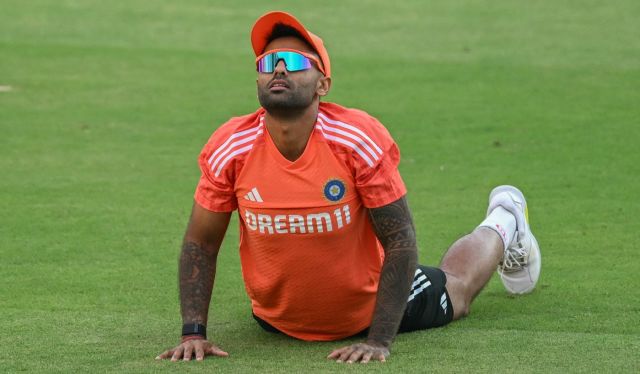 Suryakumar Yadav stretches during training