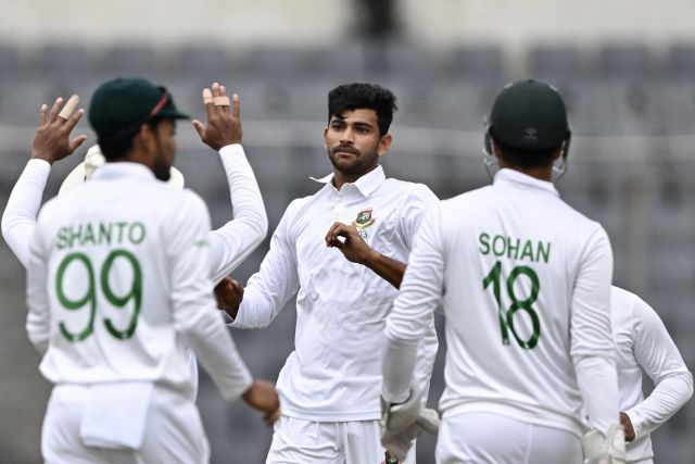 Nayeem Hasan celebrates the dismissal of Mitchell Santner