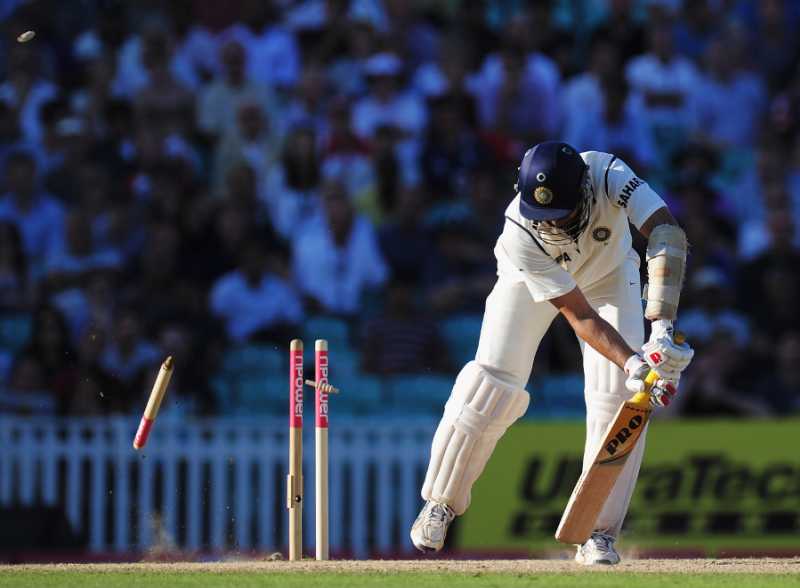 Cricket Stumps And A Cricket Ball Flying Past | Premium AI-generated Image