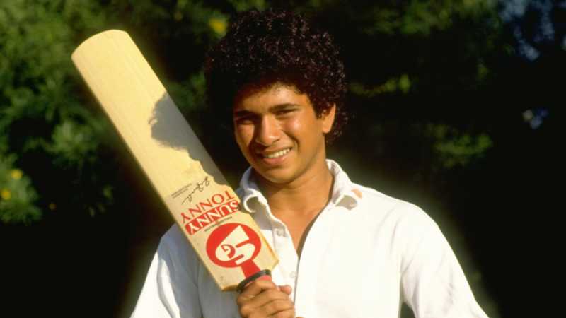 Sachin Tendulkar poses with a bat ahead of his first international tour, to Pakistan, October 1, 1989