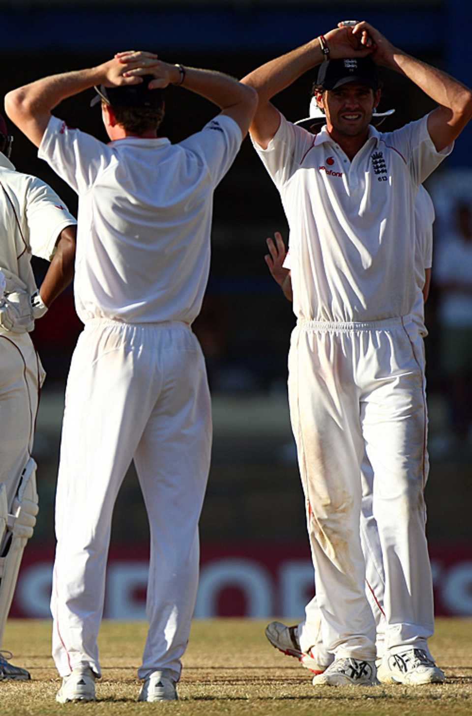 James Anderson puts his hands on his head as England are condemned to a series defeat