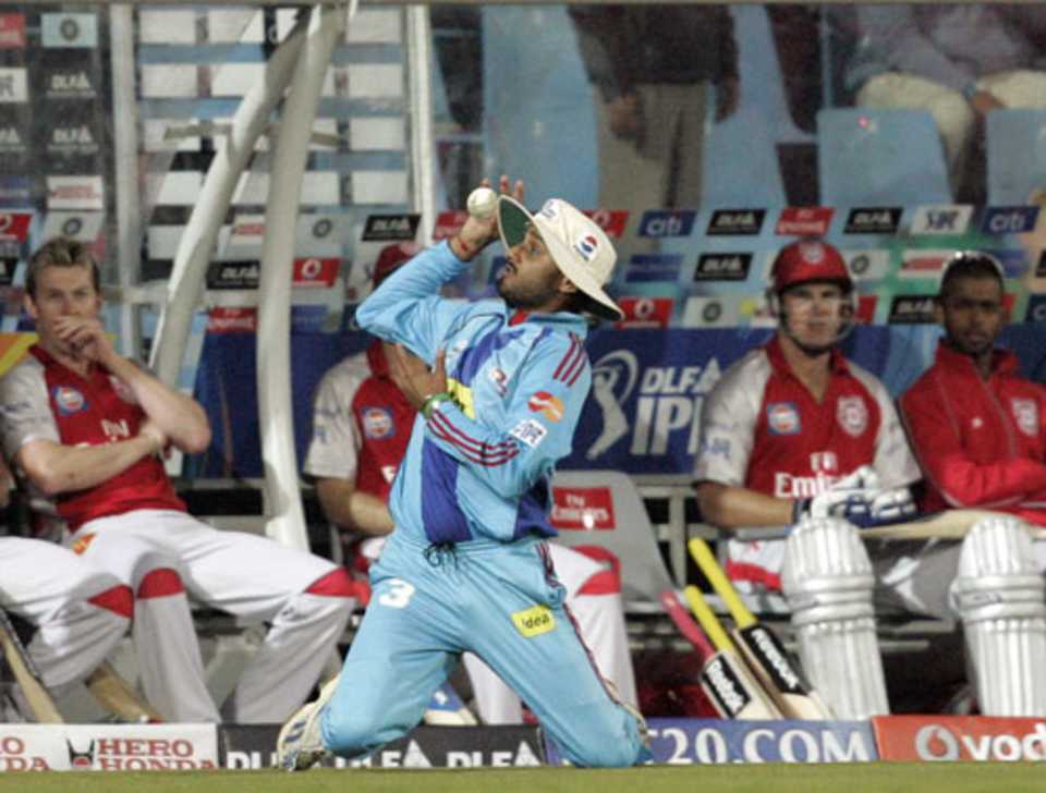Punjab players look on as Harbhajan  Singh juggles the ball before hanging on to a catch from Wilkin Mota, Kings XI Punjab v Mumbai Indians, IPL, Centurion, May 12, 2009