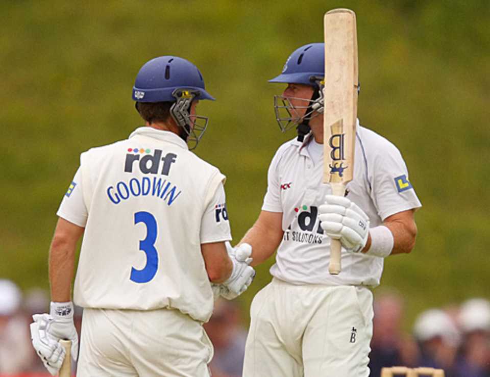 Chris Nash is congratulated on his fifty by Murray Goodwin