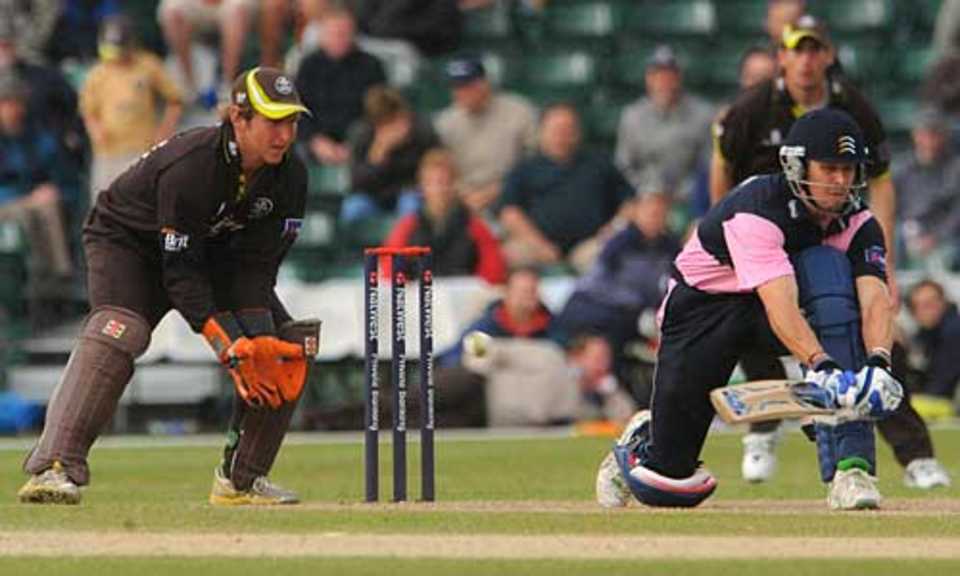 Nick Compton reverse sweeps during his unbeaten 87, Surrey v Middlesex, Pro40 Division Two, Guildford, July 19, 2009