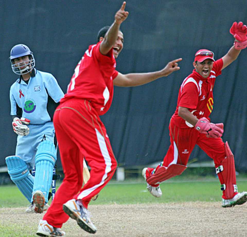 Singapore's Narender Reddy appeals for the wicket of Denzil Sequeira