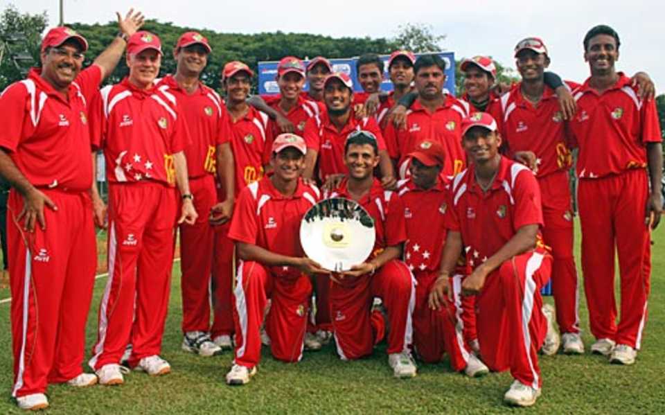 The Singapore team with the trophy