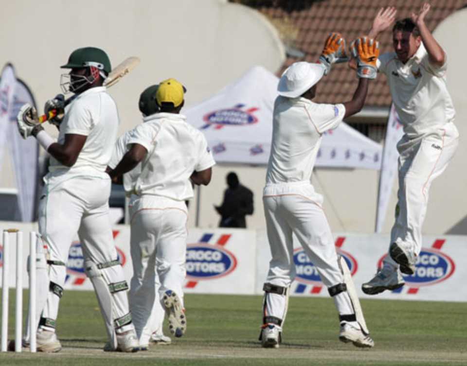 Ray Price celebrates Hamilton Masakadza's wicket 