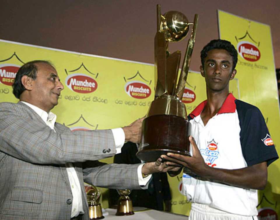 Dinal Dambarage with the winners' trophy