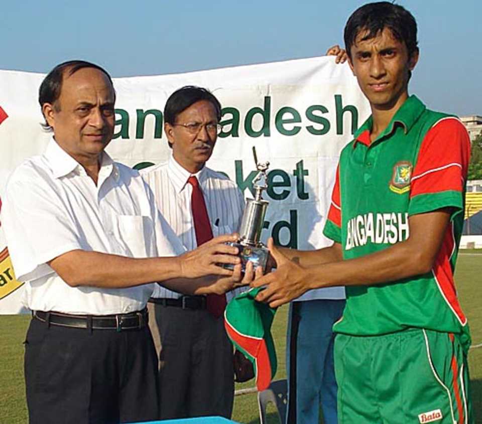 Shaker Ahmed receives the Man-of-the-Match award for his 4 for 43