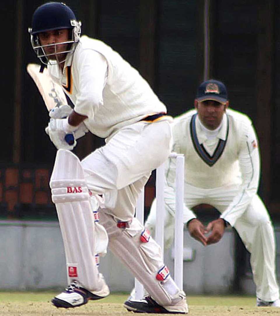 Punjab's Vishwas Bhalla watches the ball closely 