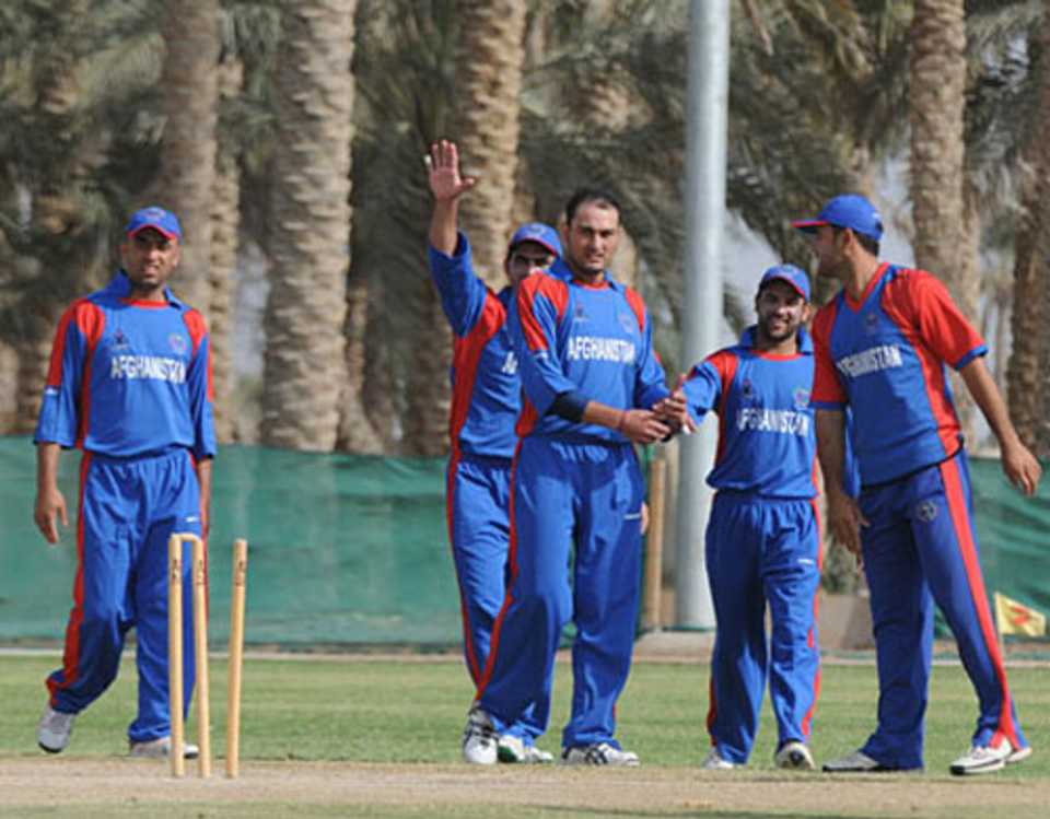 Afghanistan players celebrate a wicket on the opening day of the ACC Twenty20 Cup