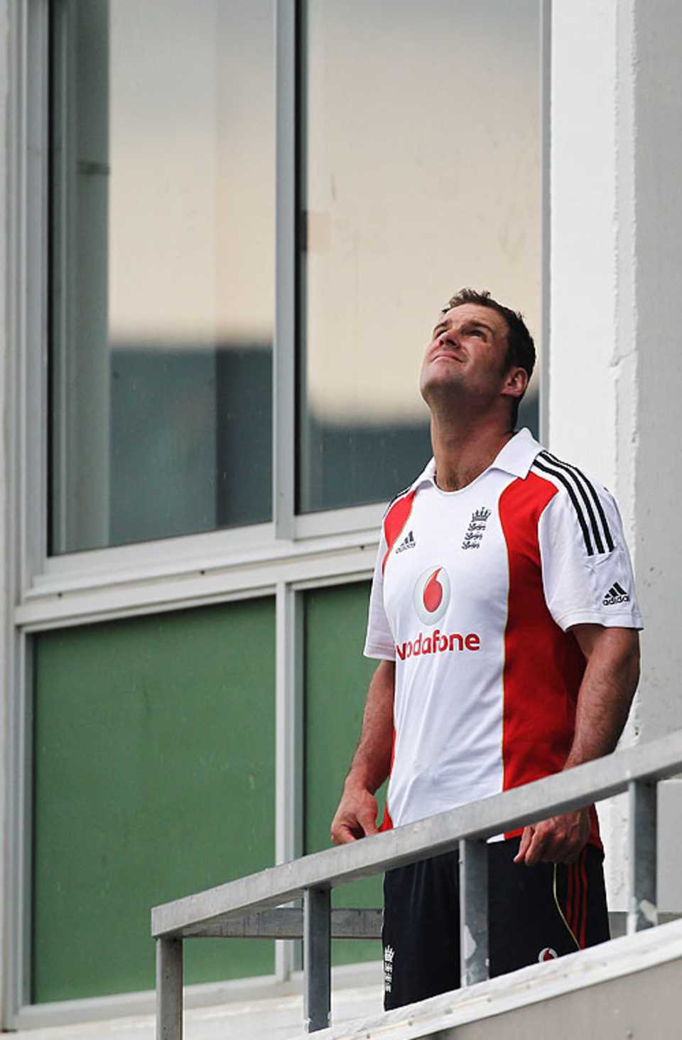 Andrew Strauss looks to the heavens as rain curtails the first day's play