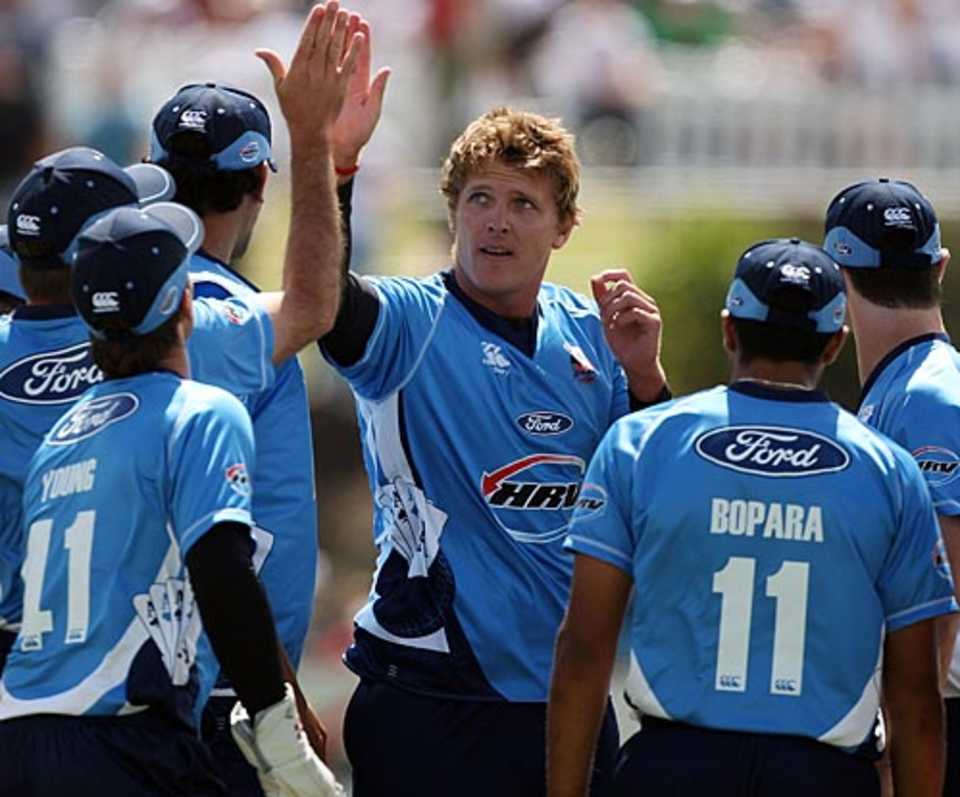 Michael Bates celebrates a wicket