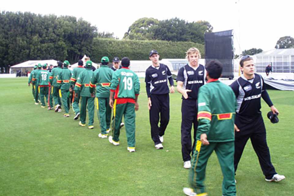Bangladesh and New Zealand players shake hands after their practice game 