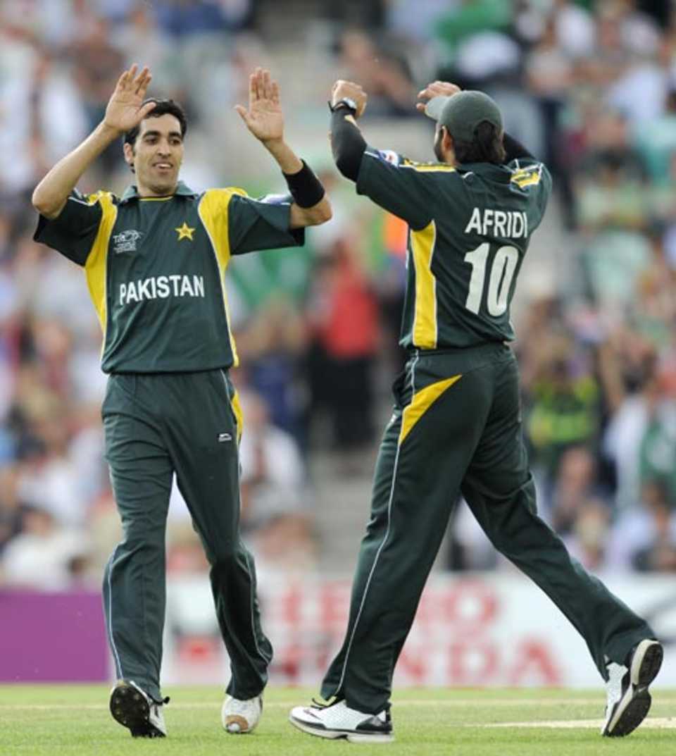 Umar Gul and Shahid Afridi celebrate a wicket