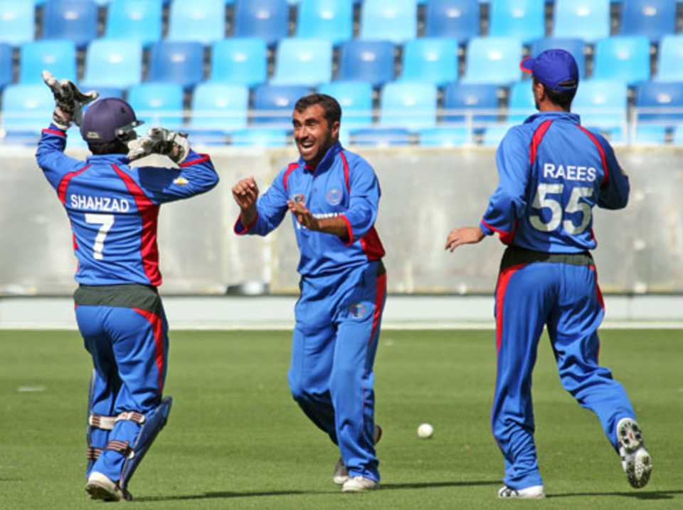 Karim Sadiq shows his delight as he celebrates a wicket