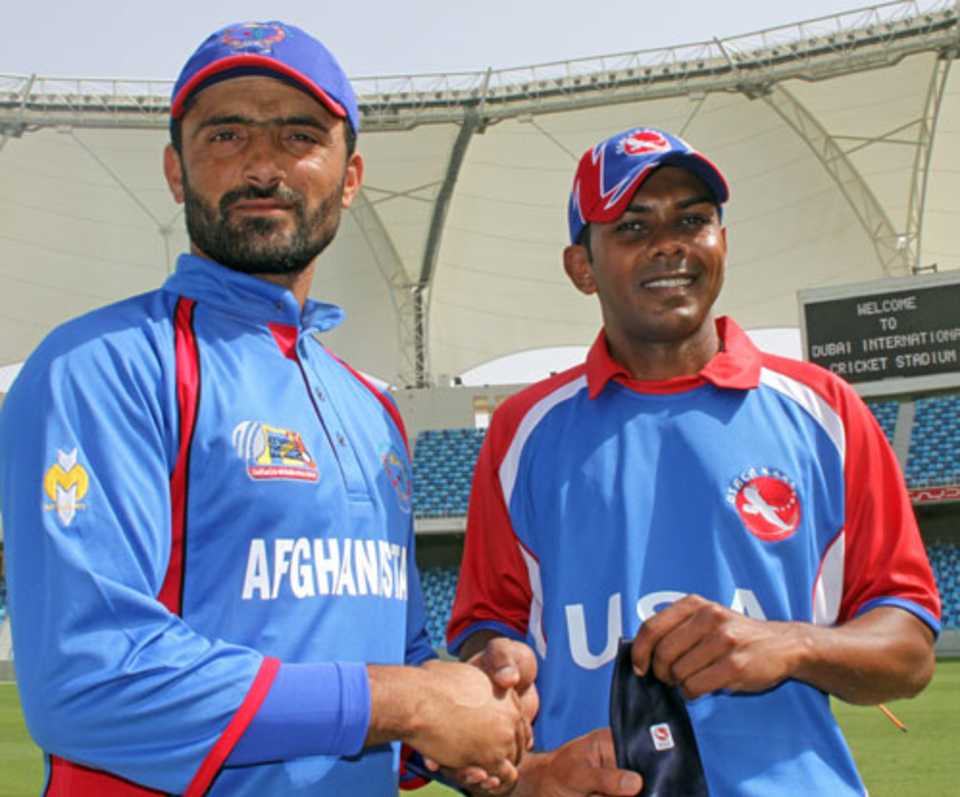 Nawroz Mangal, captain of Afghanistan, and Steve Massiah, captain of USA, before the match between their two teams