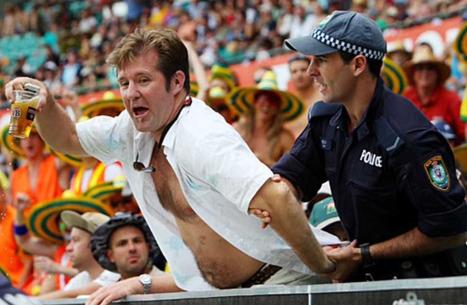 A spectator is taken away by a security staff, Australia v West Indies, 3rd ODI, Sydney, February 12, 2009 
