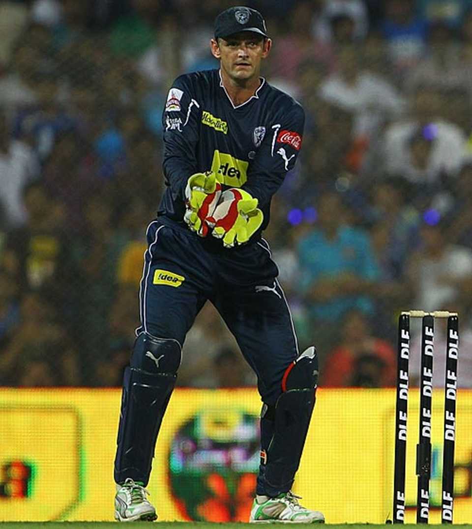 Adam Gilchrist watches a ball speed to the boundary