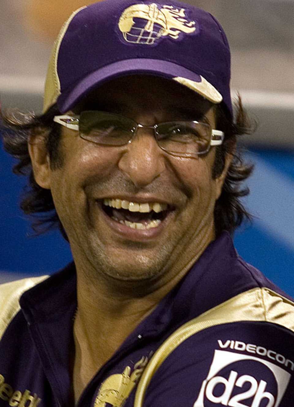 Wasim Akram relaxes in the dugout 