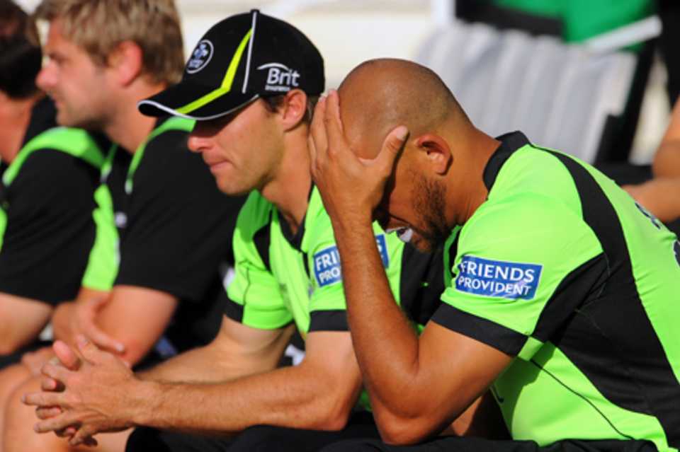 Surrey's Andrew Symonds sits dejected on the bench as his side slid to another defeat