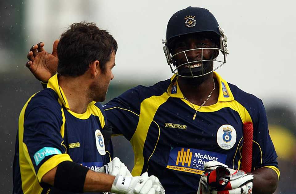 Neil McKenzie and Michael Carberry celebrate Hampshire's win