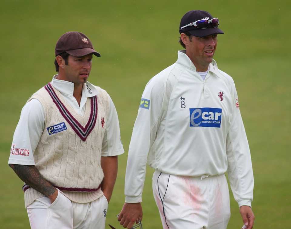 Peter Trego and Marcus Trescothick leave the field with Somerset needing 181 to win