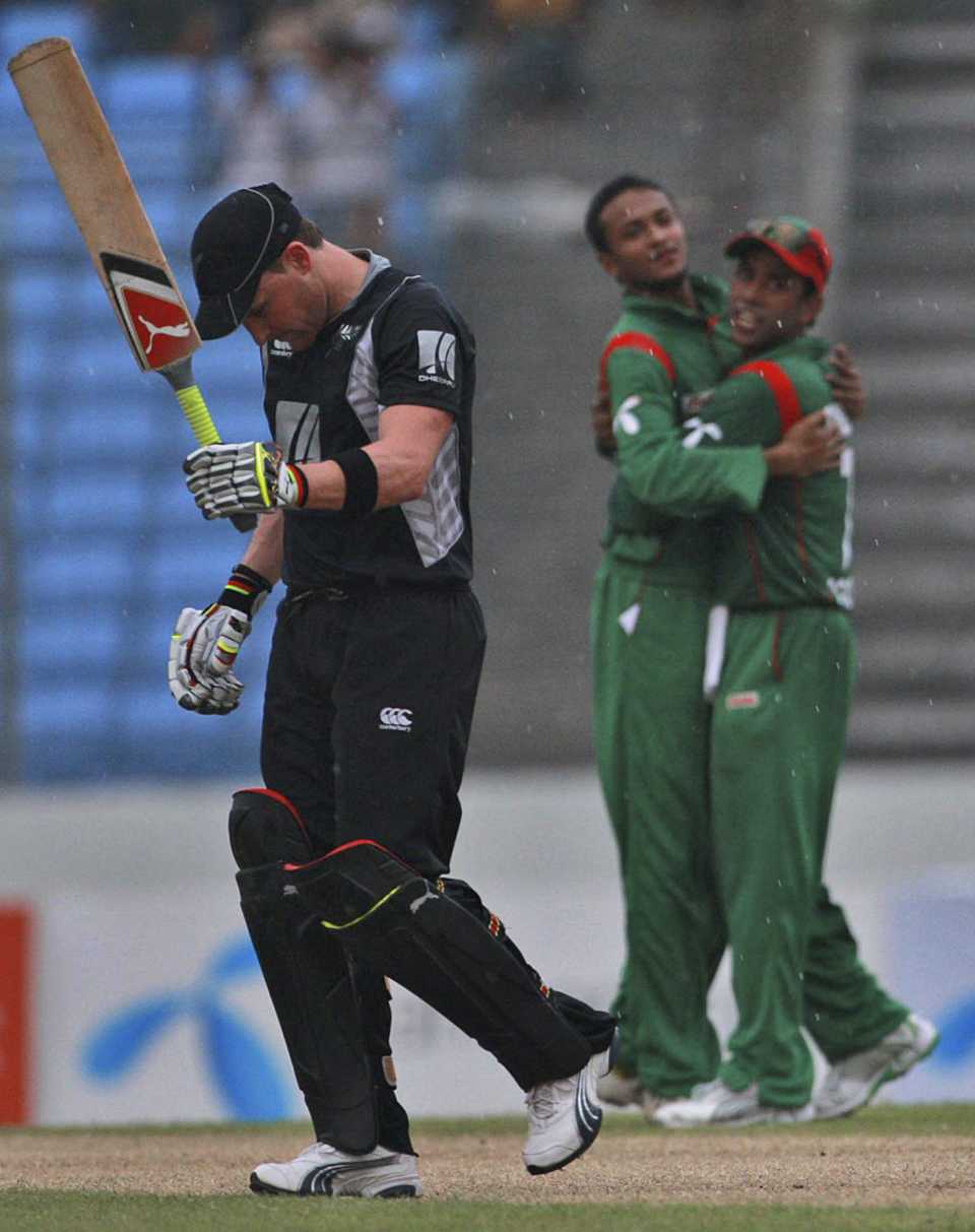 The Bangladesh fielders celebrate the dismissal of Brendan McCullum
