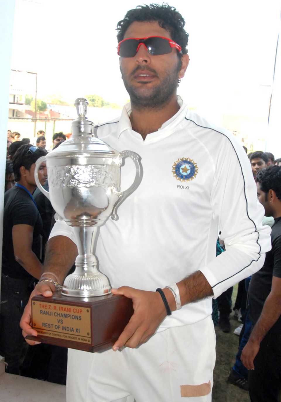 Rest of India captain Yuvraj Singh with the Irani Cup trophy