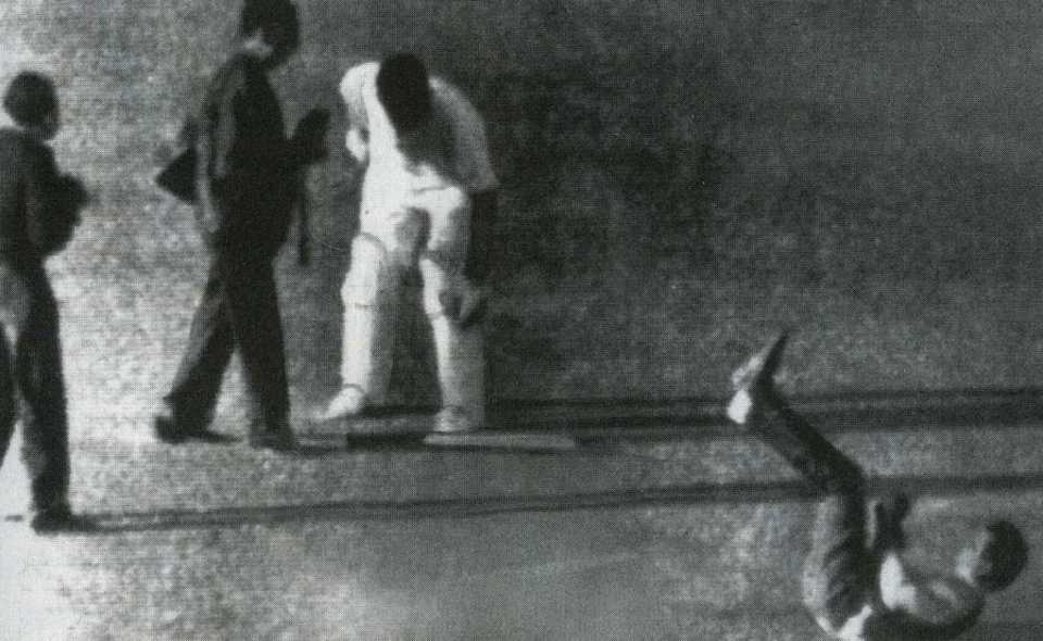 Bill Lawry was accused of striking a photographer during a pitch invasion in theTest between India and Australia in Calcutta